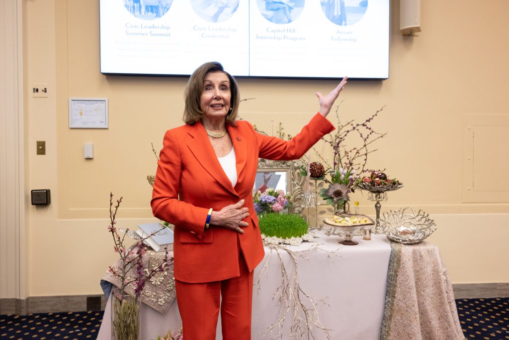 Nancy Pelosi at Nowruz Reception on Capitol Hill in front of Haftseen