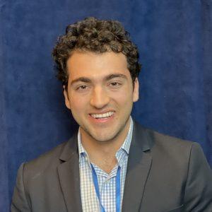 Nader Granmayeh CHIP Fellow, young Iranian American man with curly hair